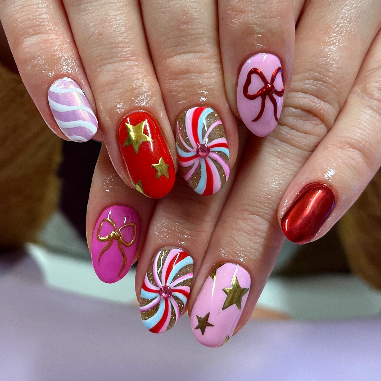 Candy Cane Swirls And Gold Star Christmas Nails