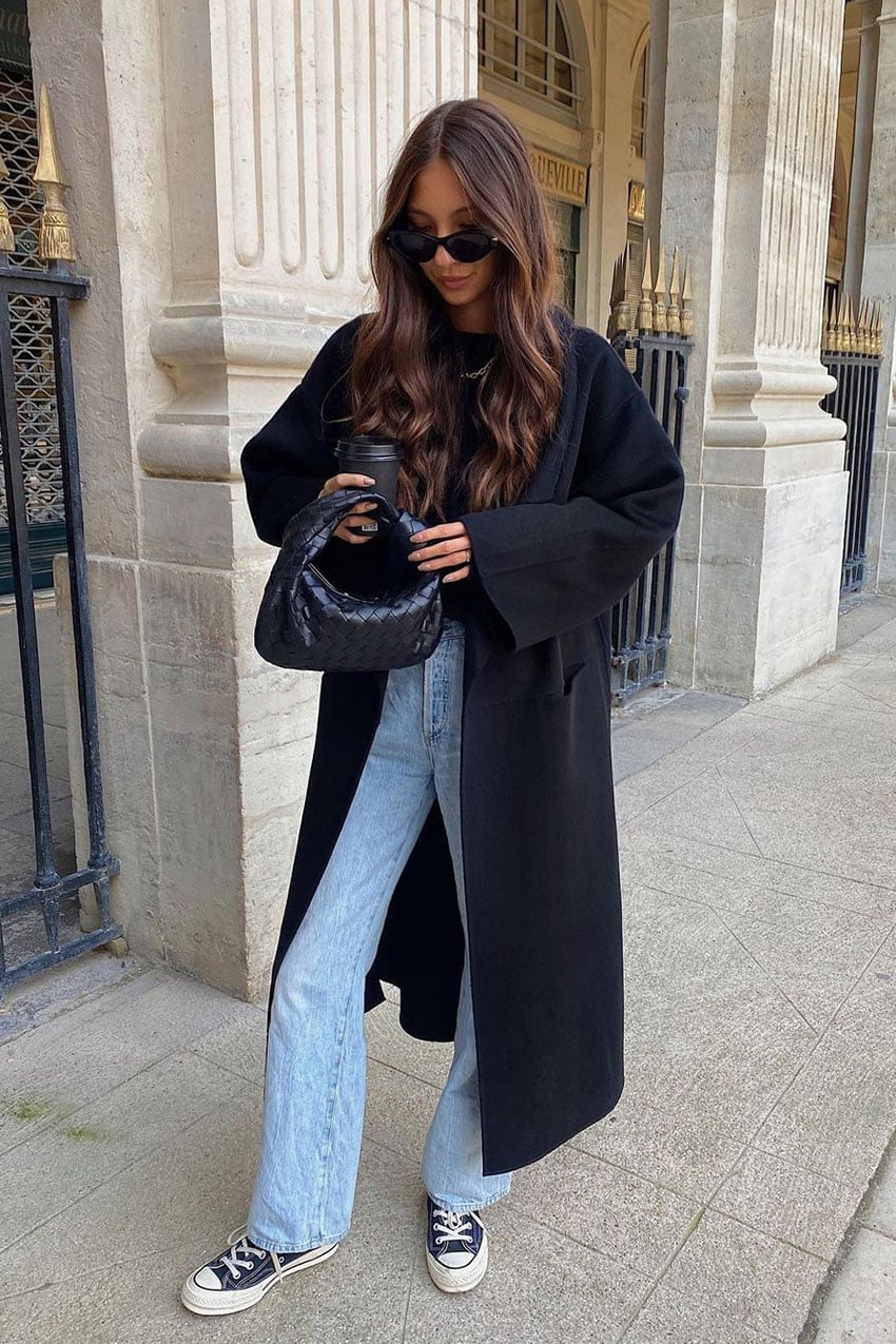 Black wool coat with light blue jeans and sneakers — Casual Winter Outfits