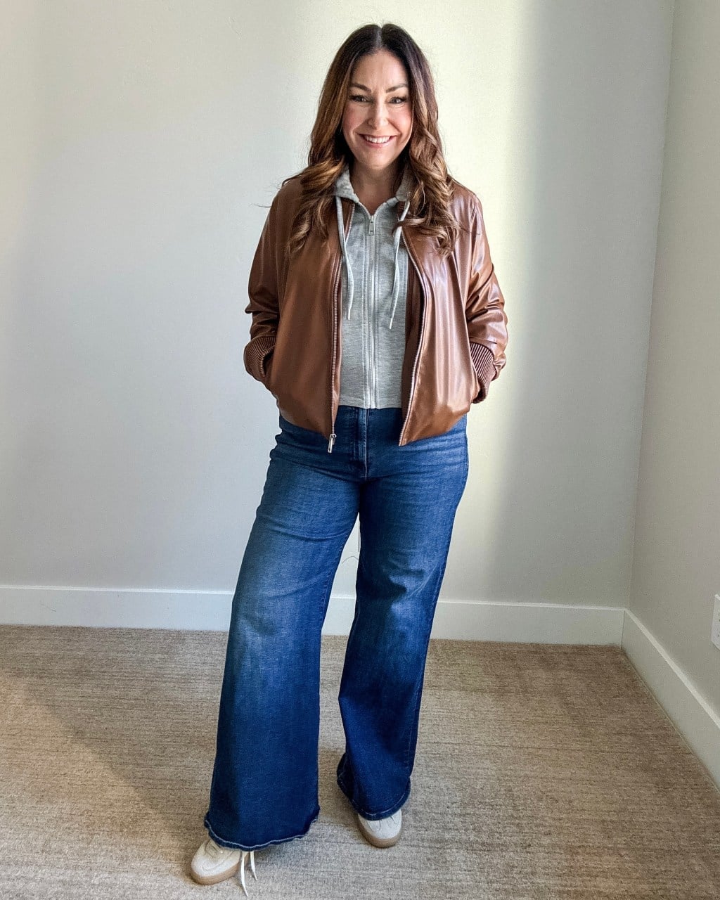 Brown leather bomber jacket with gray hoodie and jeans — Casual Winter Outfits