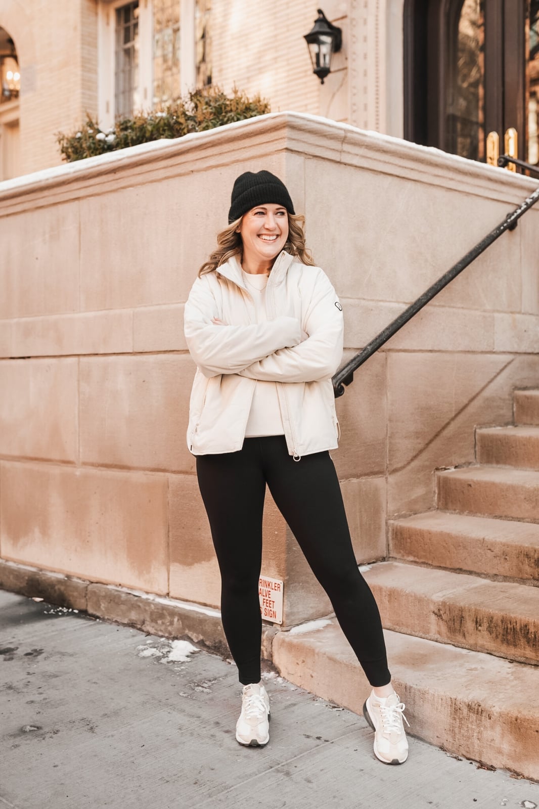 Cream puffer jacket with black leggings and sneakers, Close-Up Take — Casual Winter Outfits