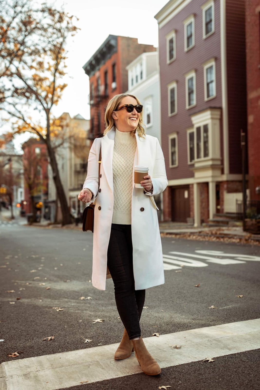 White wool coat with cream knit sweater and black pants — Casual Winter Outfits