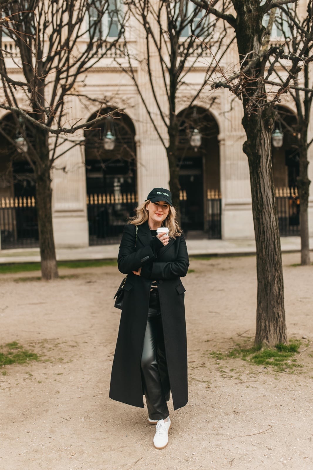 Long black wool coat with straight-leg pants and sneakers — Casual Winter Outfits