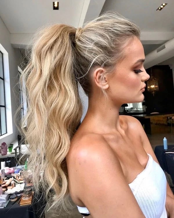 Platinum Blonde High Ponytail With Waves — Christmas Party Hairstyles