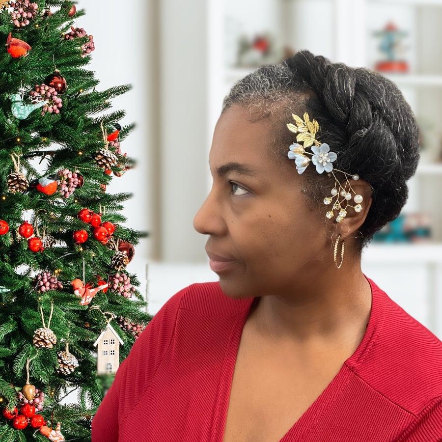 Short Dark Coily Braided Updo With Floral Piece, Side — Christmas Party Hairstyles