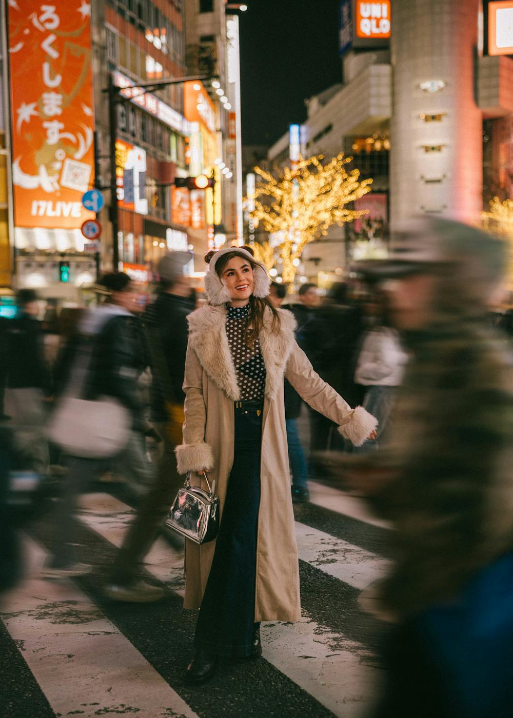 Beige faux fur trim coat with polka dot blouse and dark pants — Cold Weather Outfits