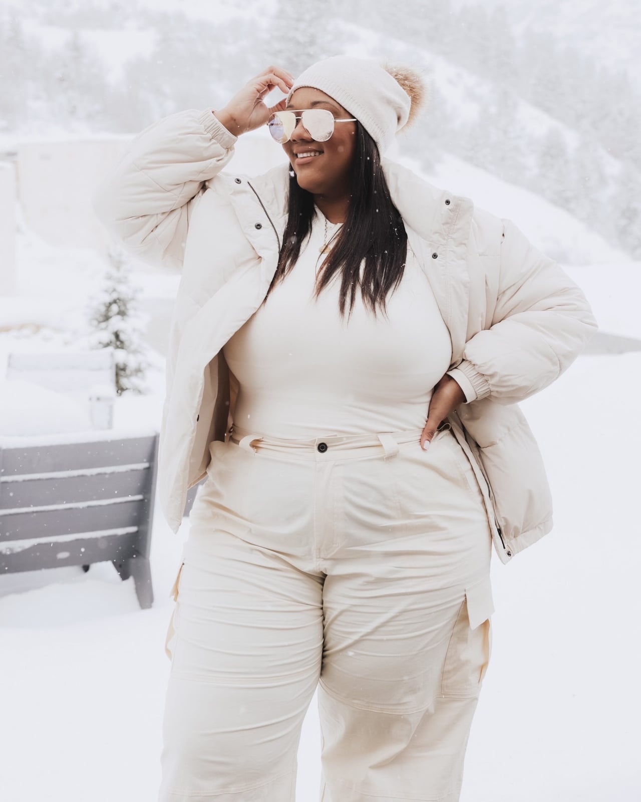 Cream puffer jacket with cream cargo pants and tan boots — Cold Weather Outfits