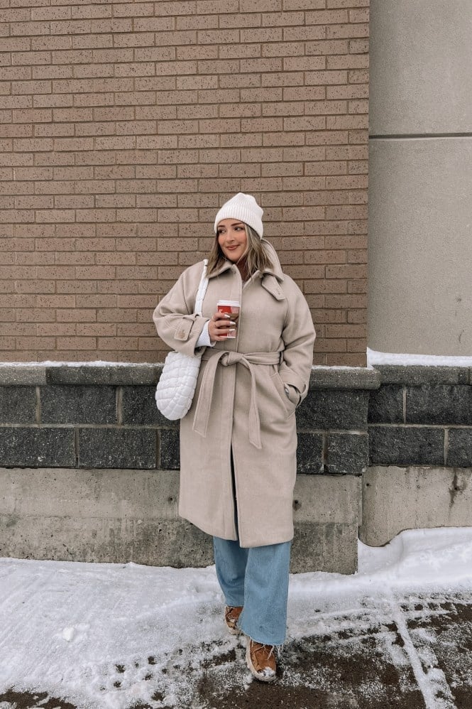 Beige tie-waist coat with white top and light blue jeans — Cold Weather Outfits
