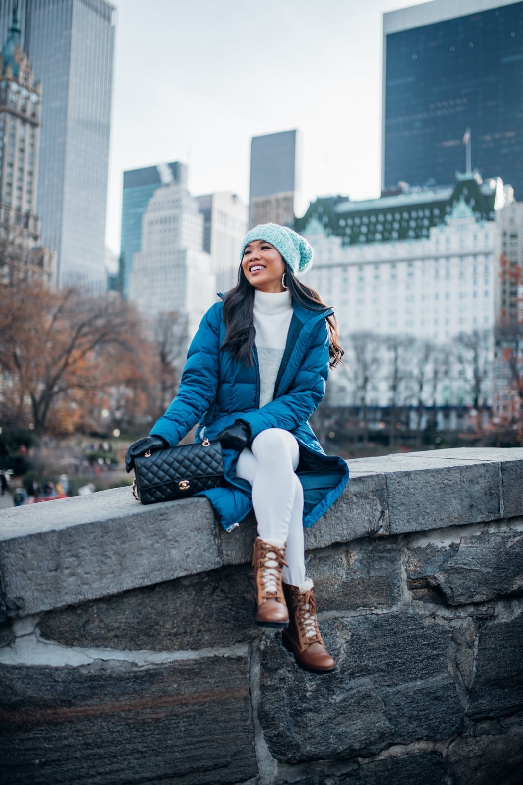 Bright blue puffer coat over white turtleneck and leggings — Cold Weather Outfits