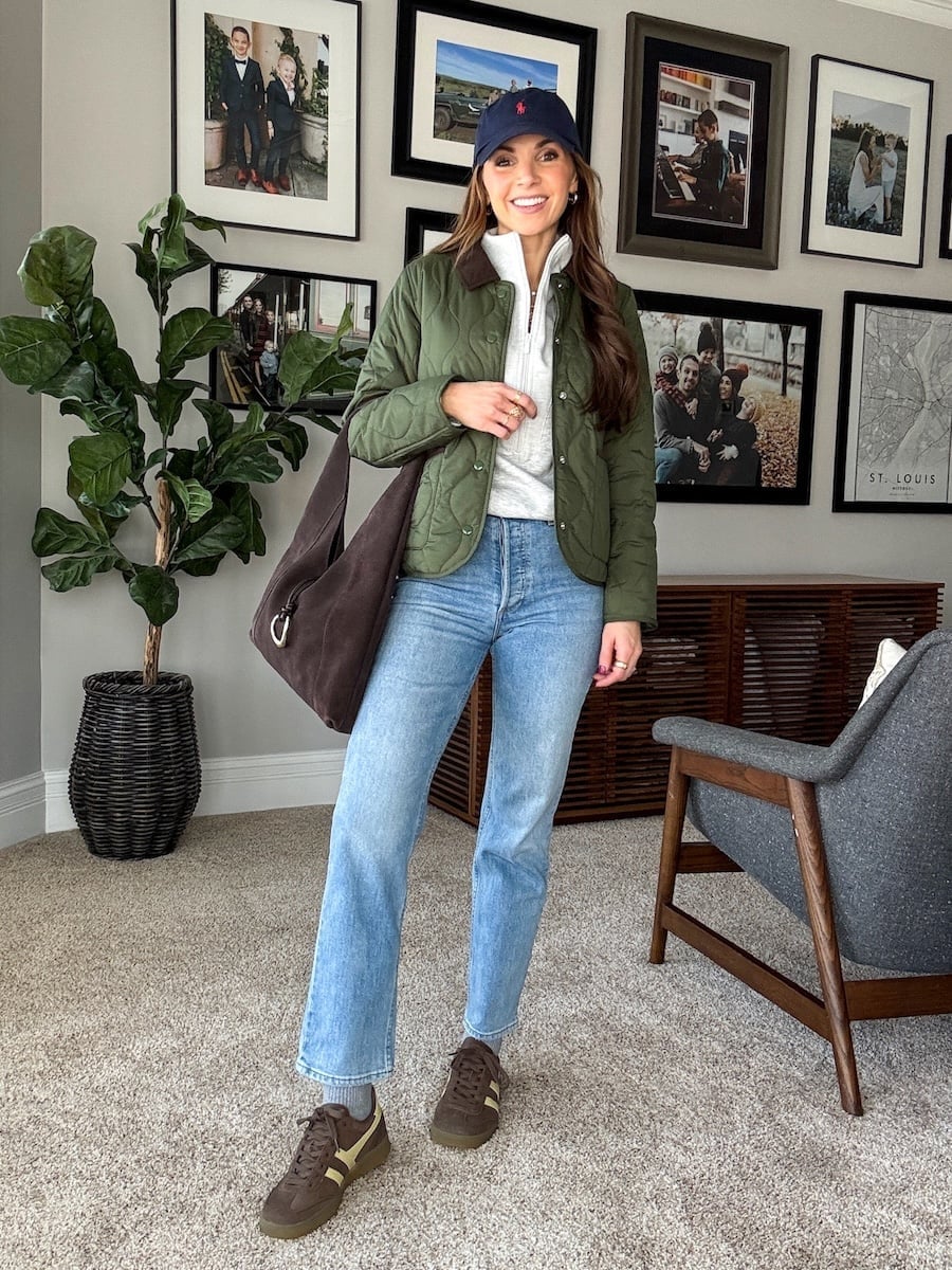 Green quilted jacket with quarter-zip pullover and light blue jeans — Cold Weather Outfits