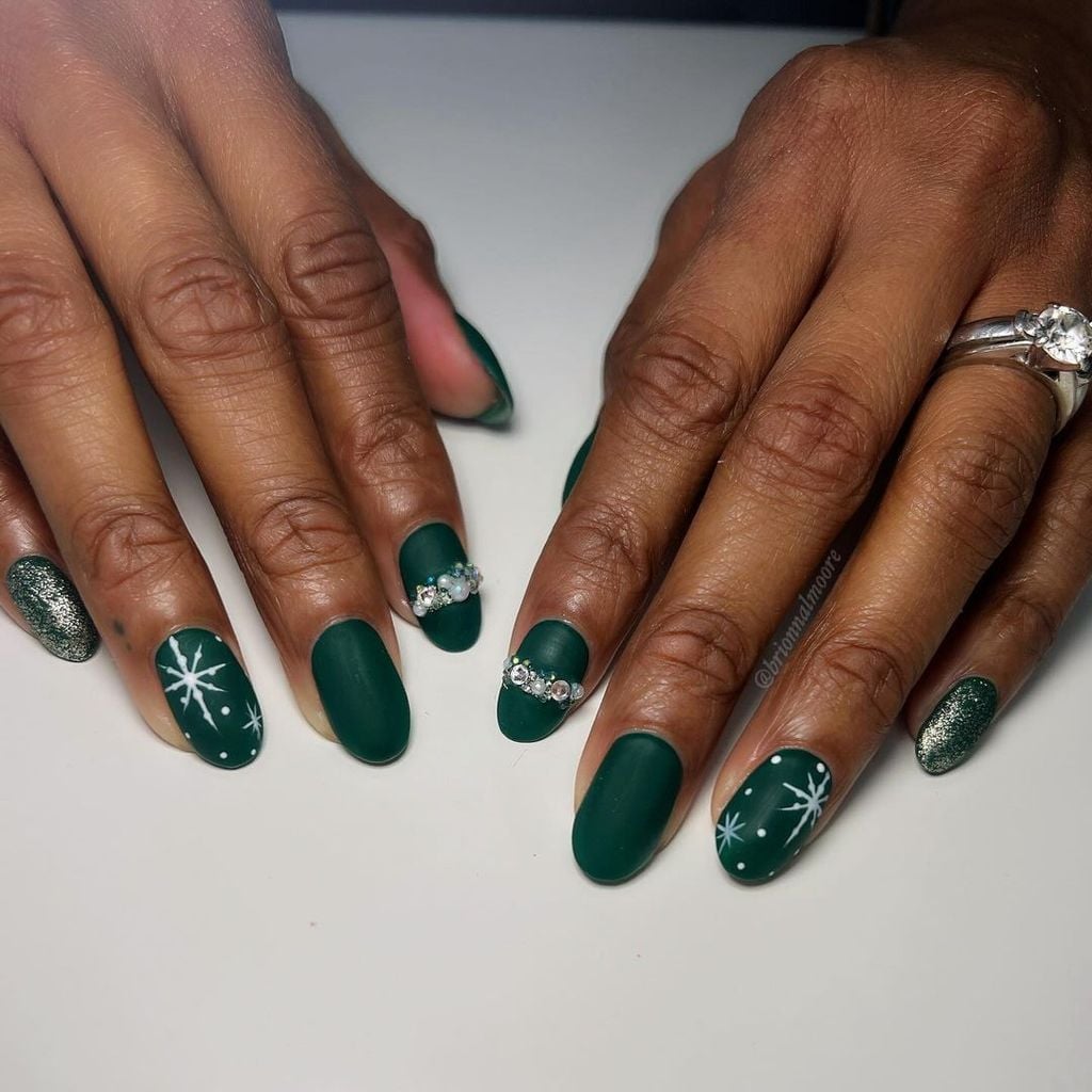 Short Oval Matte Green with Snowflakes and Rhinestones — Dark Green Christmas Nails