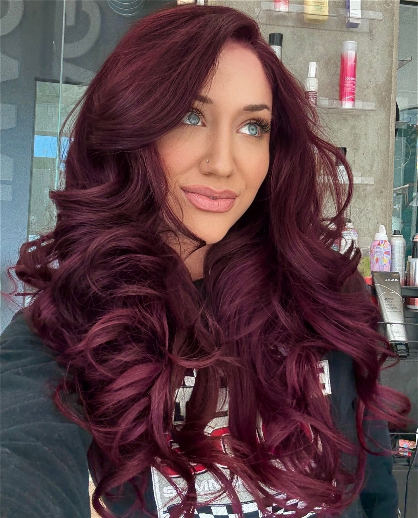 Deep Burgundy Waves With Face-Framing Layers