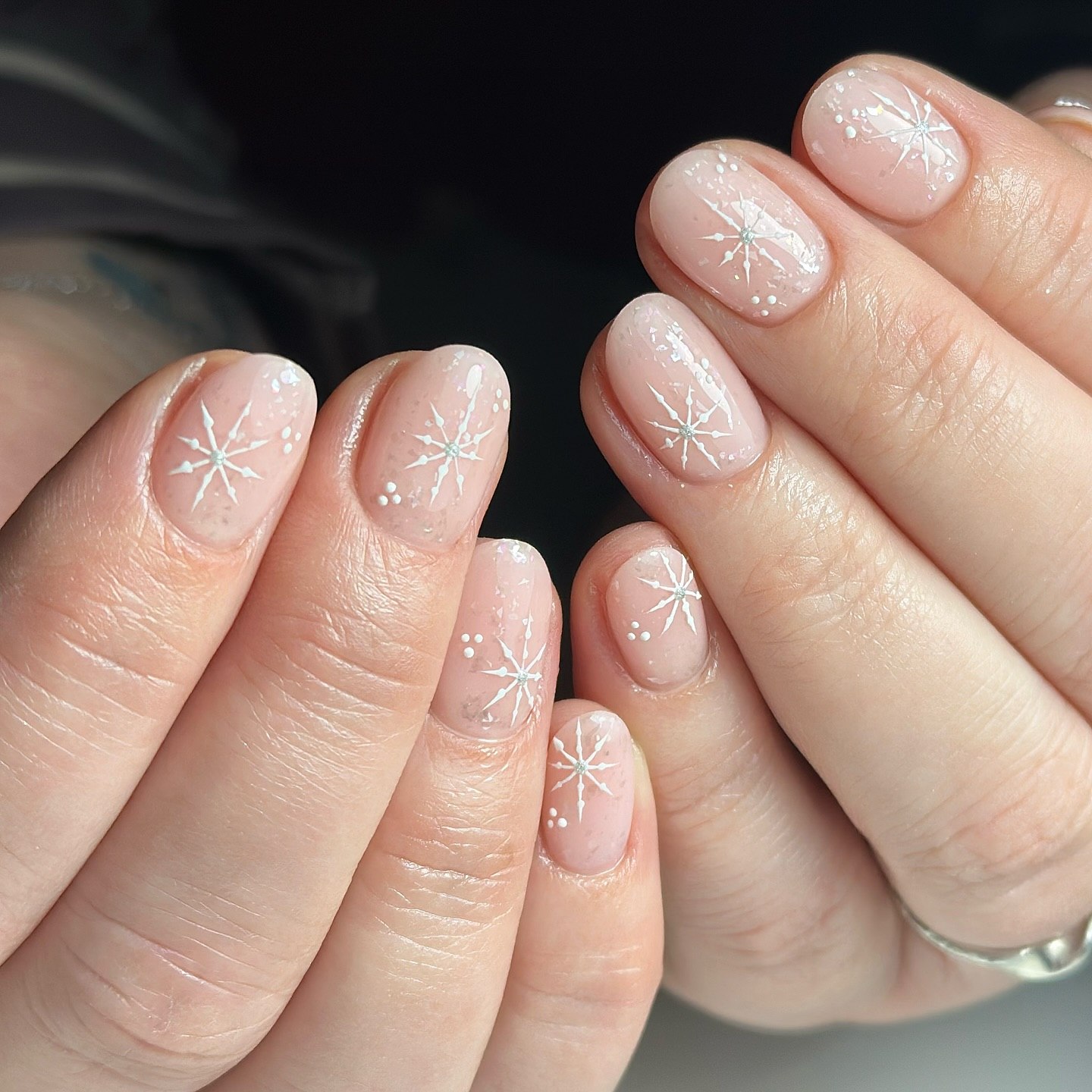 Delicate White Snowflake Oval Nails