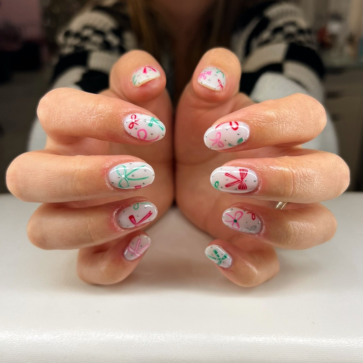 Festive Bows and Glitter Oval Nails