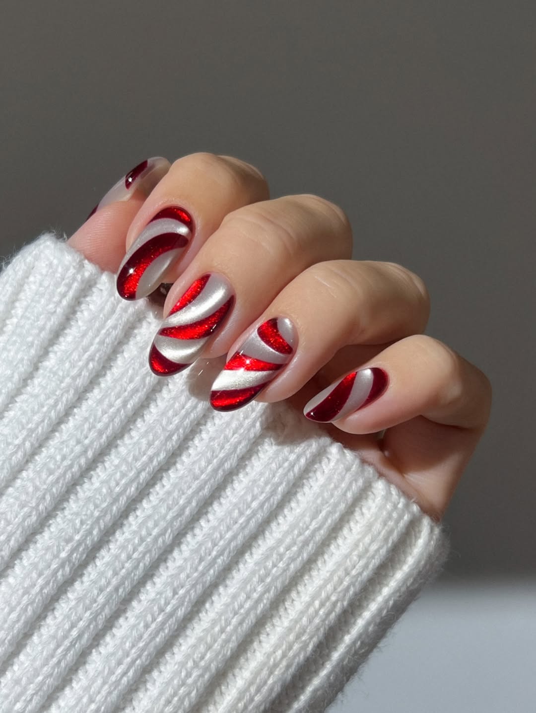 Festive Red And White Candy Cane Swirl Nails