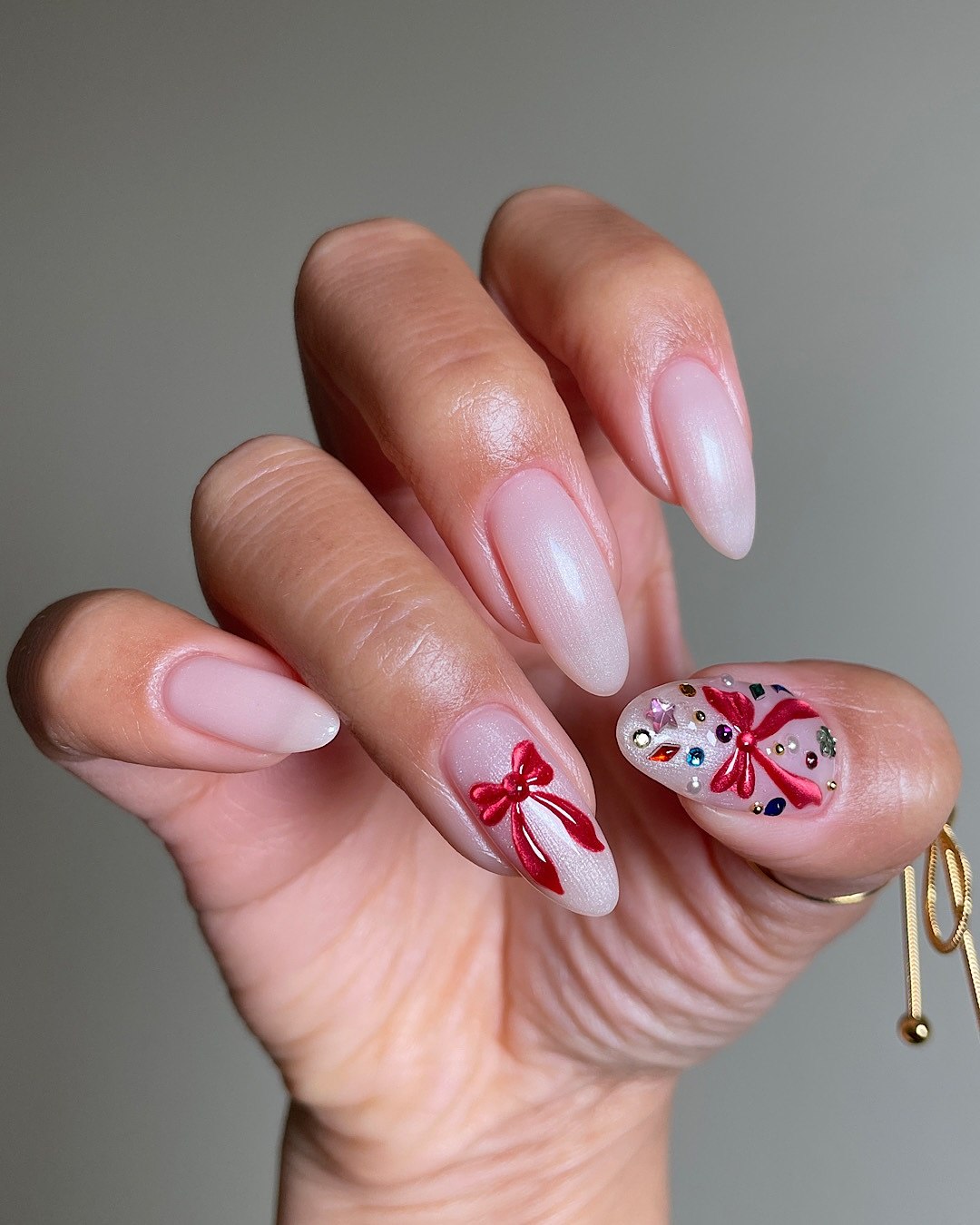 Festive Red Bows & Sparkle Christmas Almond Nails