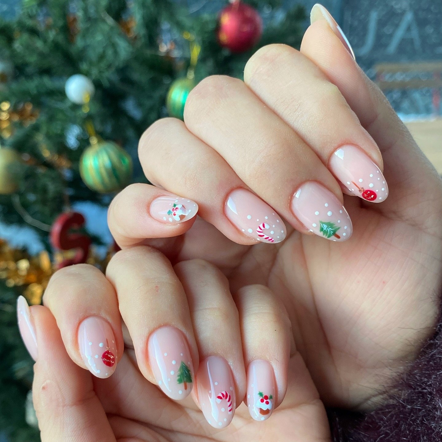 Glossy Milky White Almond Nails with Hand Painted Christmas Motifs