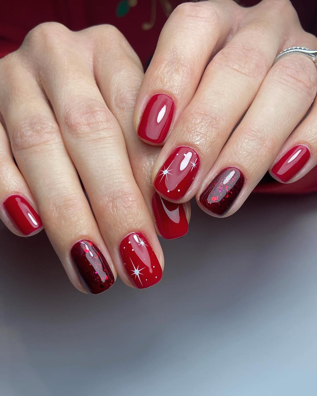 Glossy Red Short Nails with Sparkling Stars
