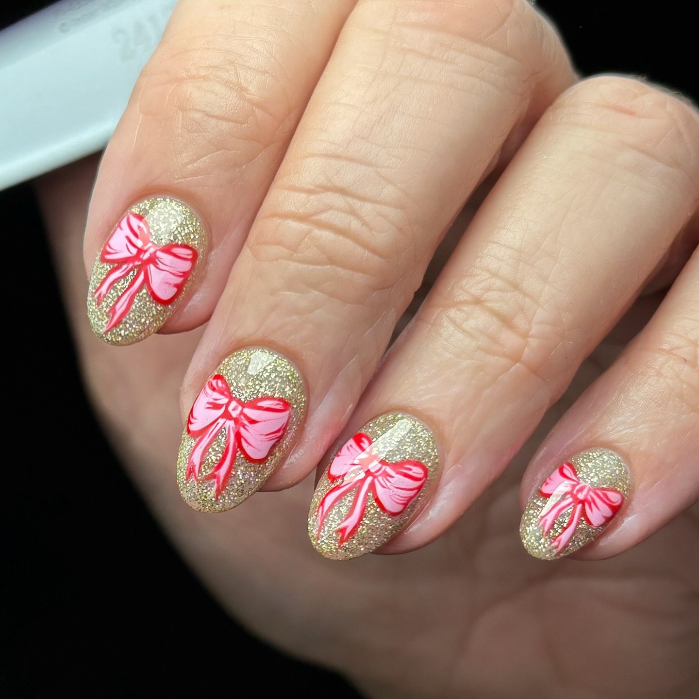 Gold Glitter Base Pink Bow Christmas Nails