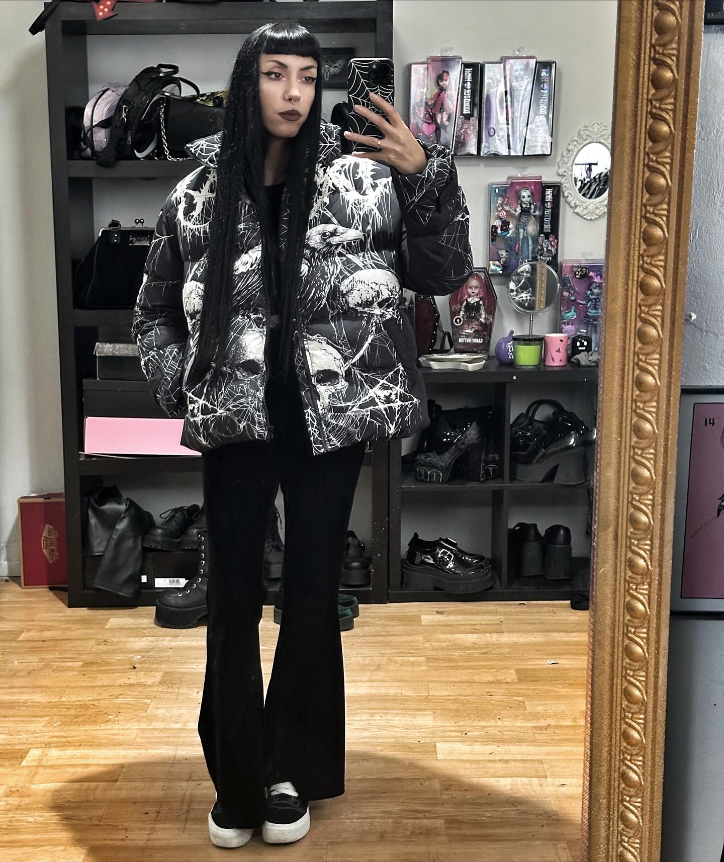 Graphic Puffer And Black Flare Jeans Outfit
