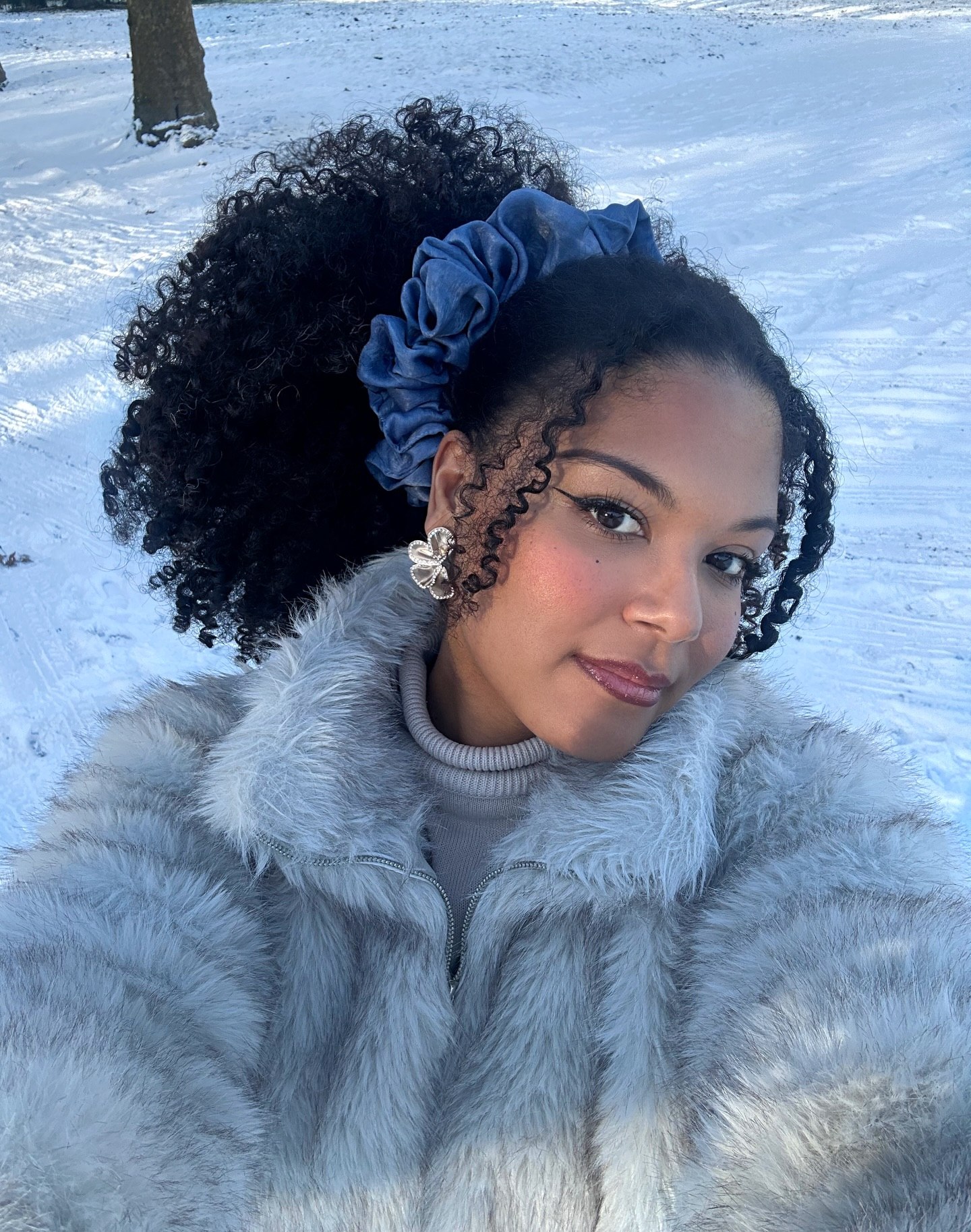 High Textured Ponytail With Bold Blue Scrunchie