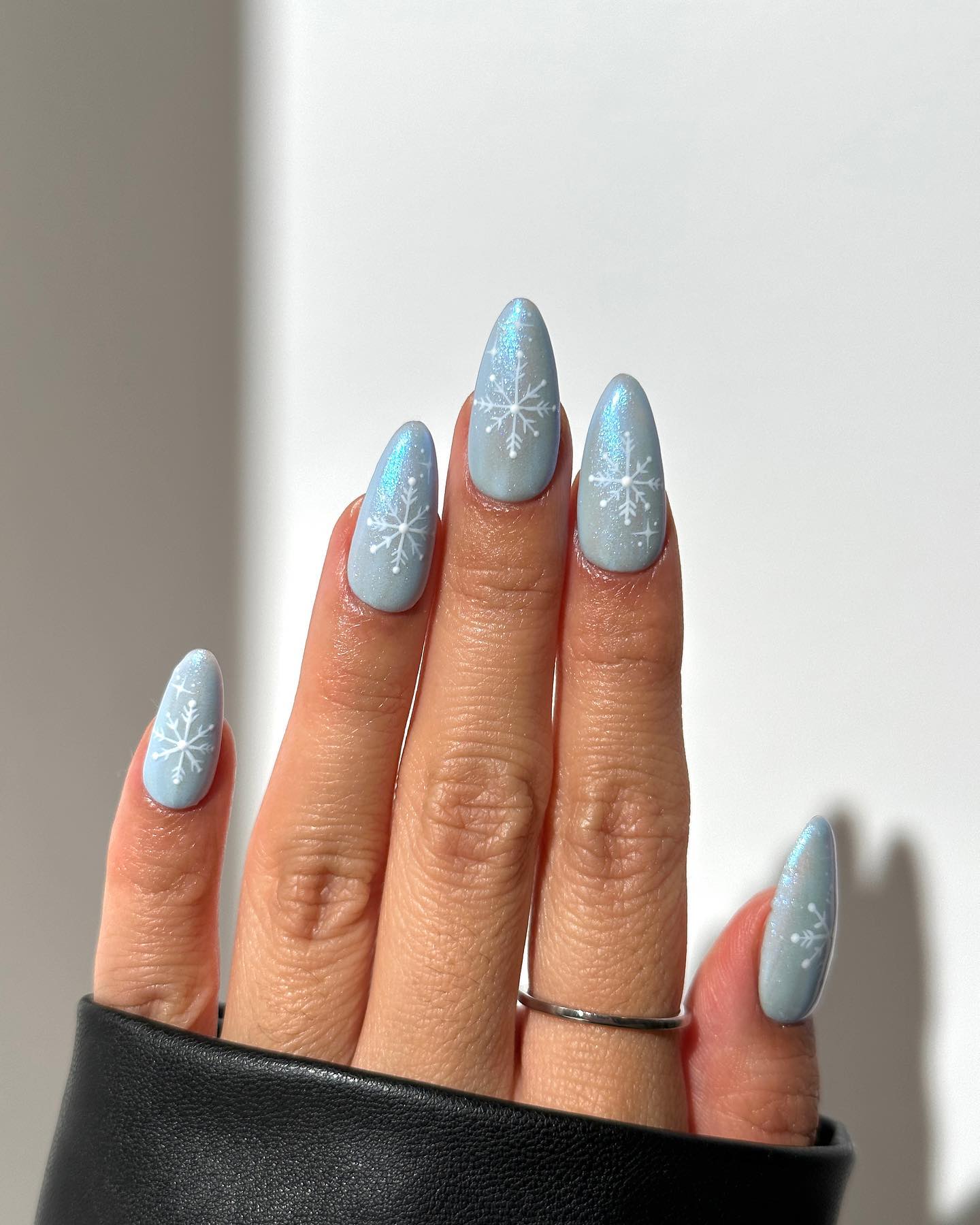 Matte Blue Snowflake Almond Nails