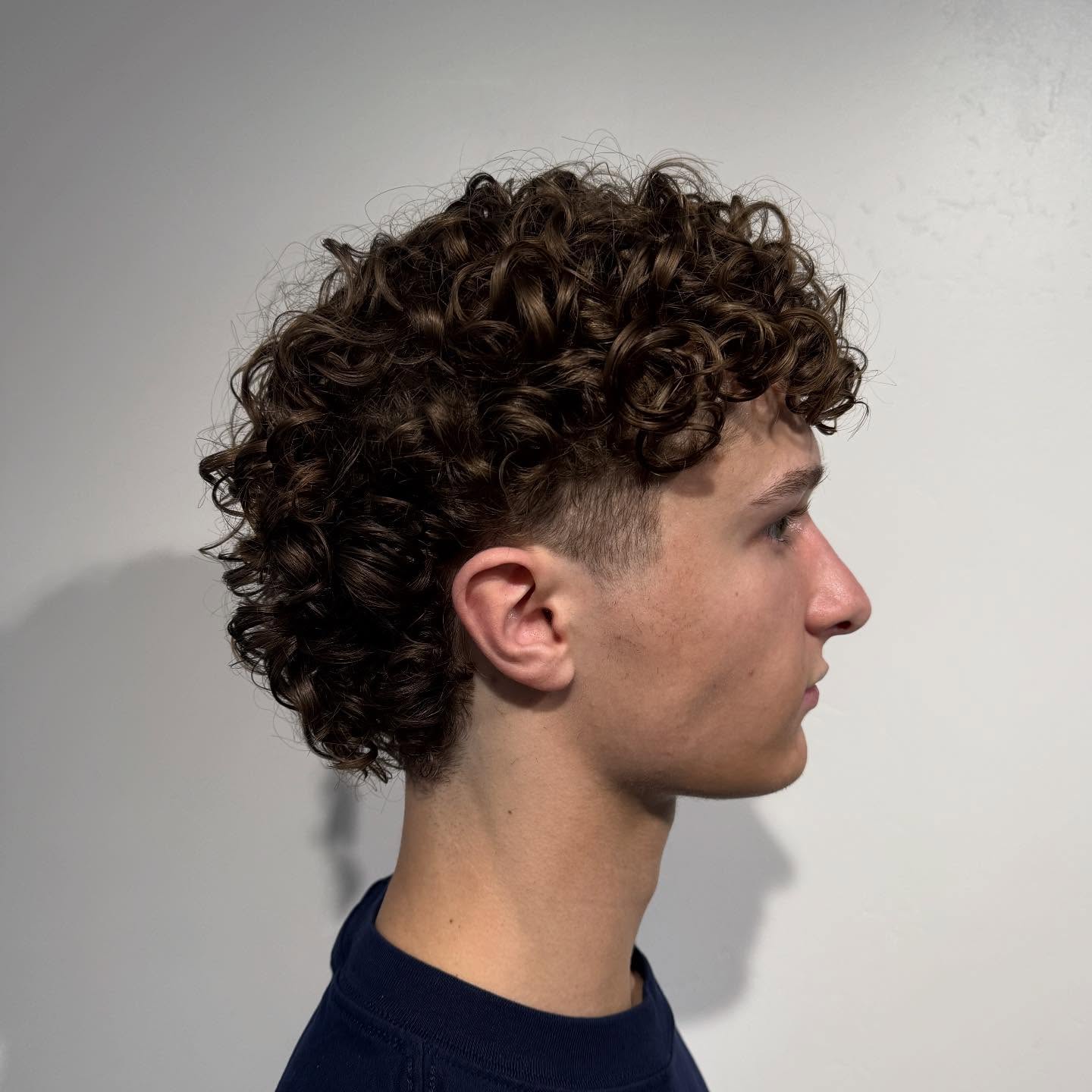 Modern Mullet With Textured Curls On Men