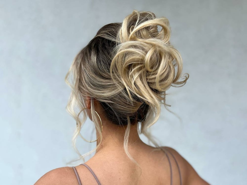 Textured Blonde Updo With Dark Roots — New Years Eve Hairstyles