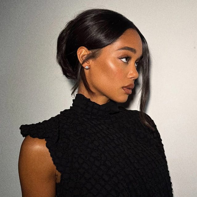 Dark Brown Low Bun With Wispy Strands — New Years Eve Hairstyles