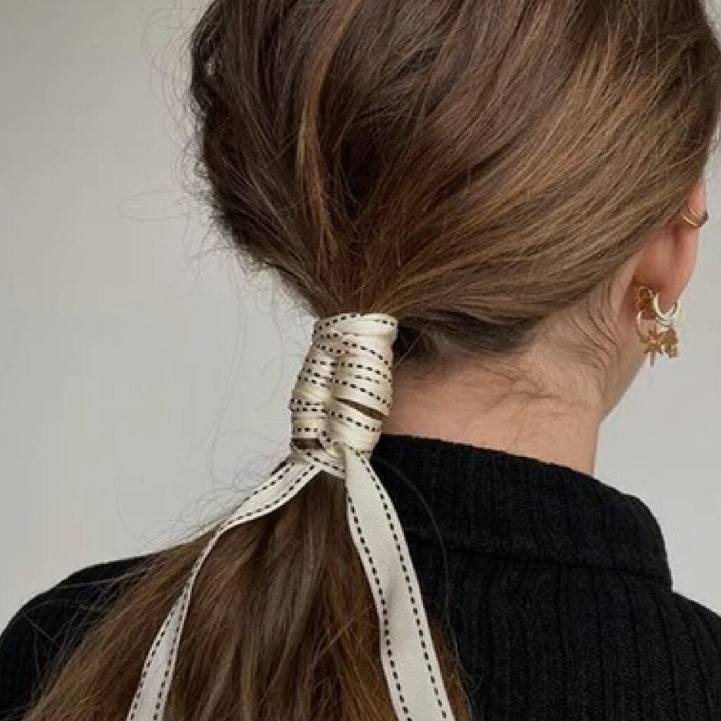 Medium Brown Ponytail With Ribbon Detail — New Years Eve Hairstyles