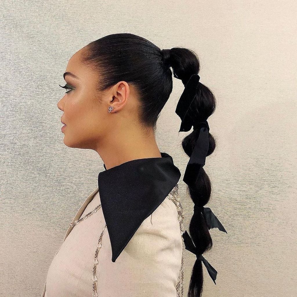 Black Bubble Ponytail With Ribbon Accents — New Years Eve Hairstyles