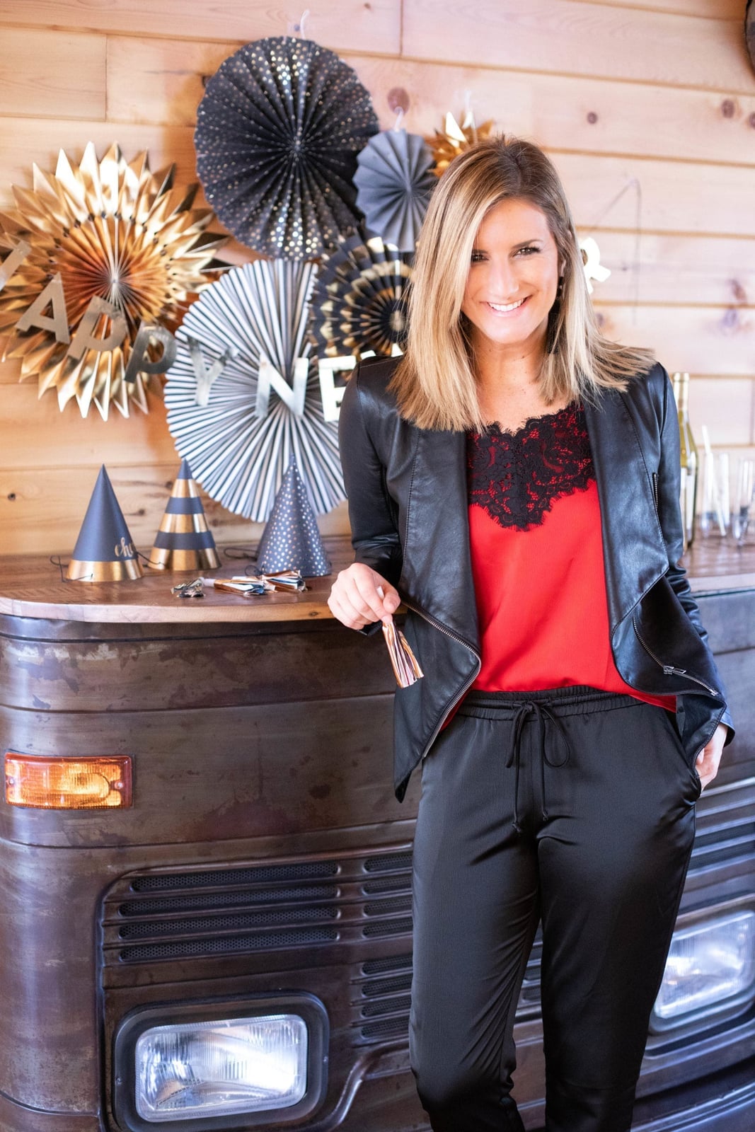 Leather jacket over lace camisole and satin joggers — New Years Eve Outfits Casual