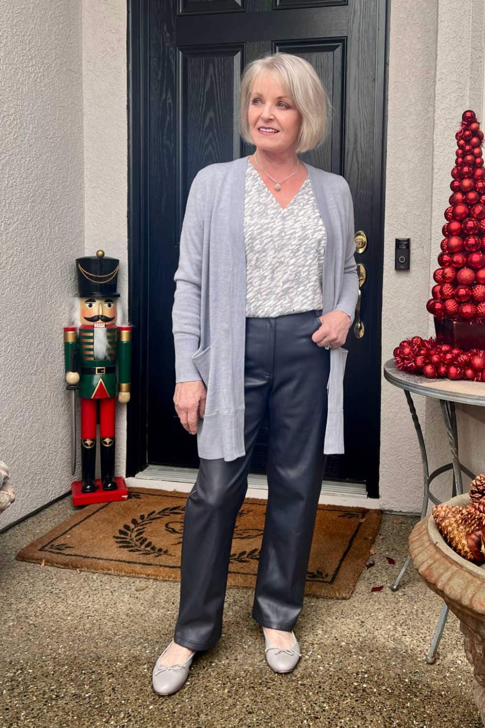 Leather trousers with a patterned cardigan — New Years Eve Outfits Casual