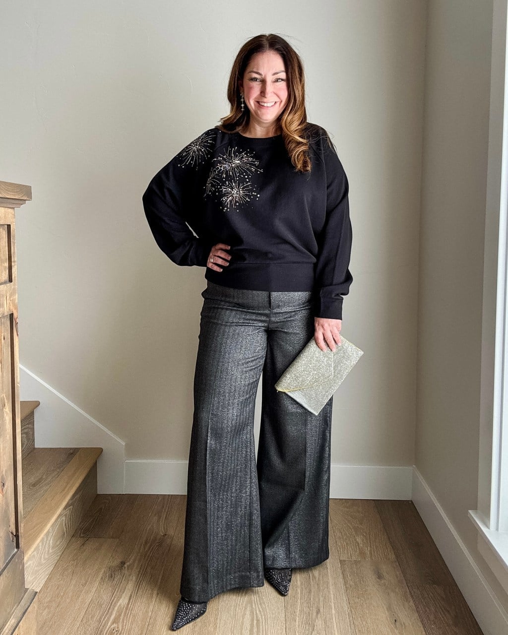 Sequin sweatshirt with metallic gray trousers — New Years Eve Outfits Casual