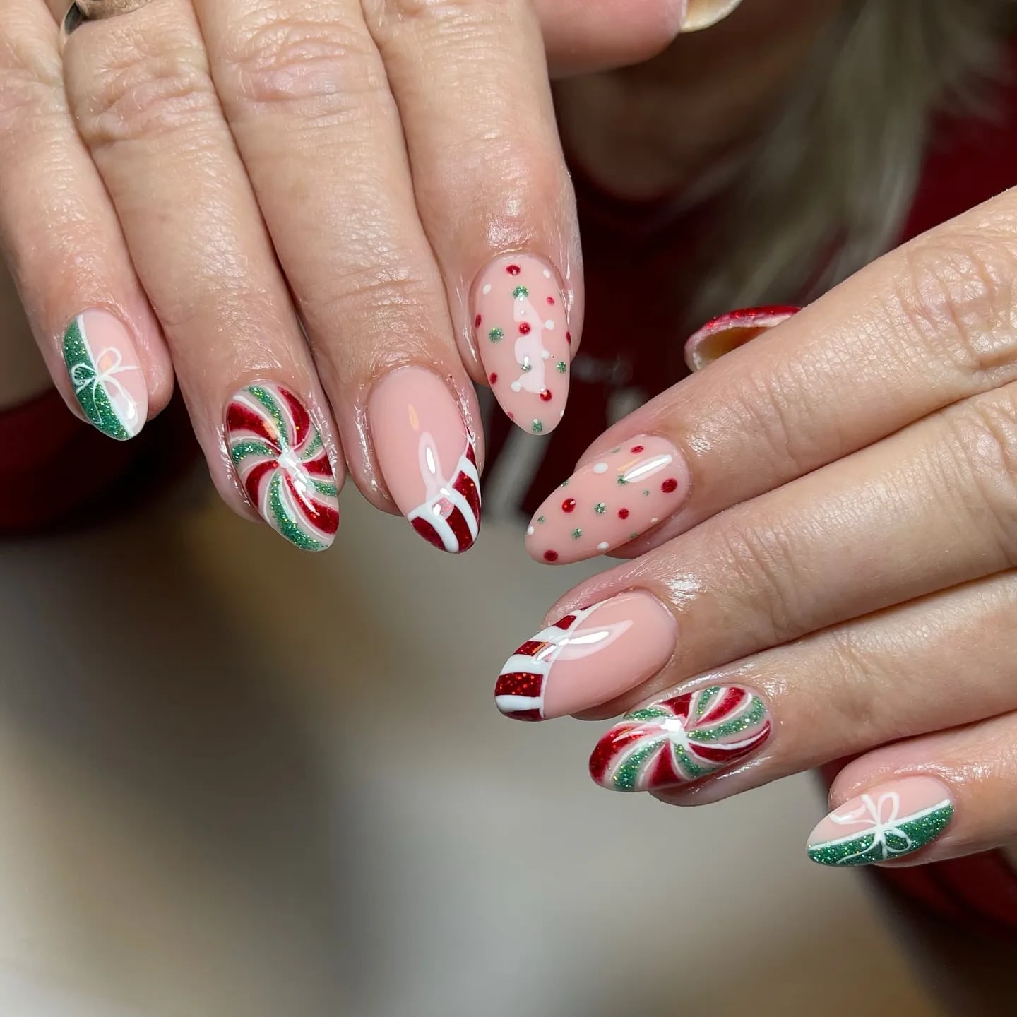 Medium Almond Pink Nude With Mixed Motifs, Glossy With Glitter Accents Medium Almond Pink Nude With Mixed Motifs, Glossy With Glitter Accents — Nude Christmas Nails