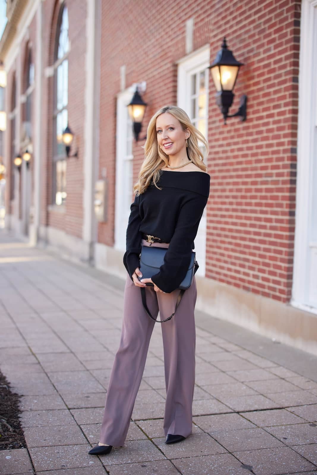 Black Off-Shoulder Sweater with Mauve Wide-Leg Trousers — NYE Outfits