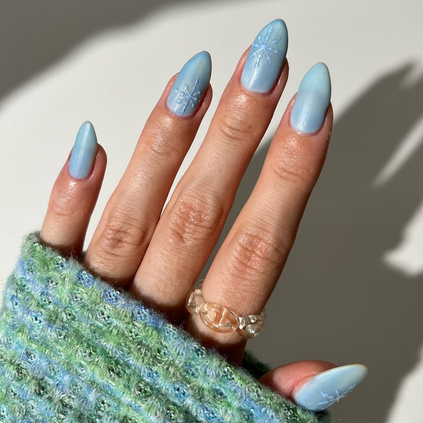 Powdery Blue Matte Snowflake Almond Nails