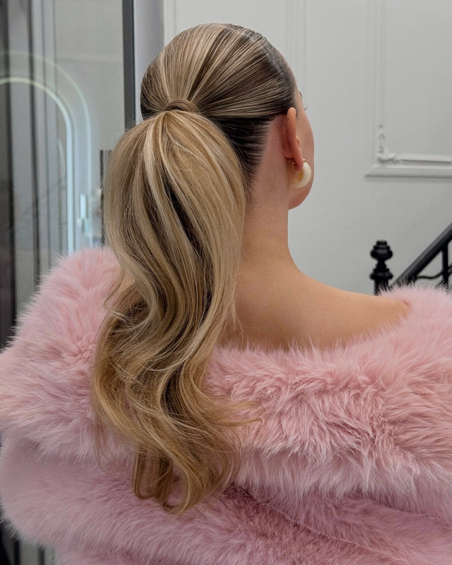 Sleek High Ponytail With Loose Waves