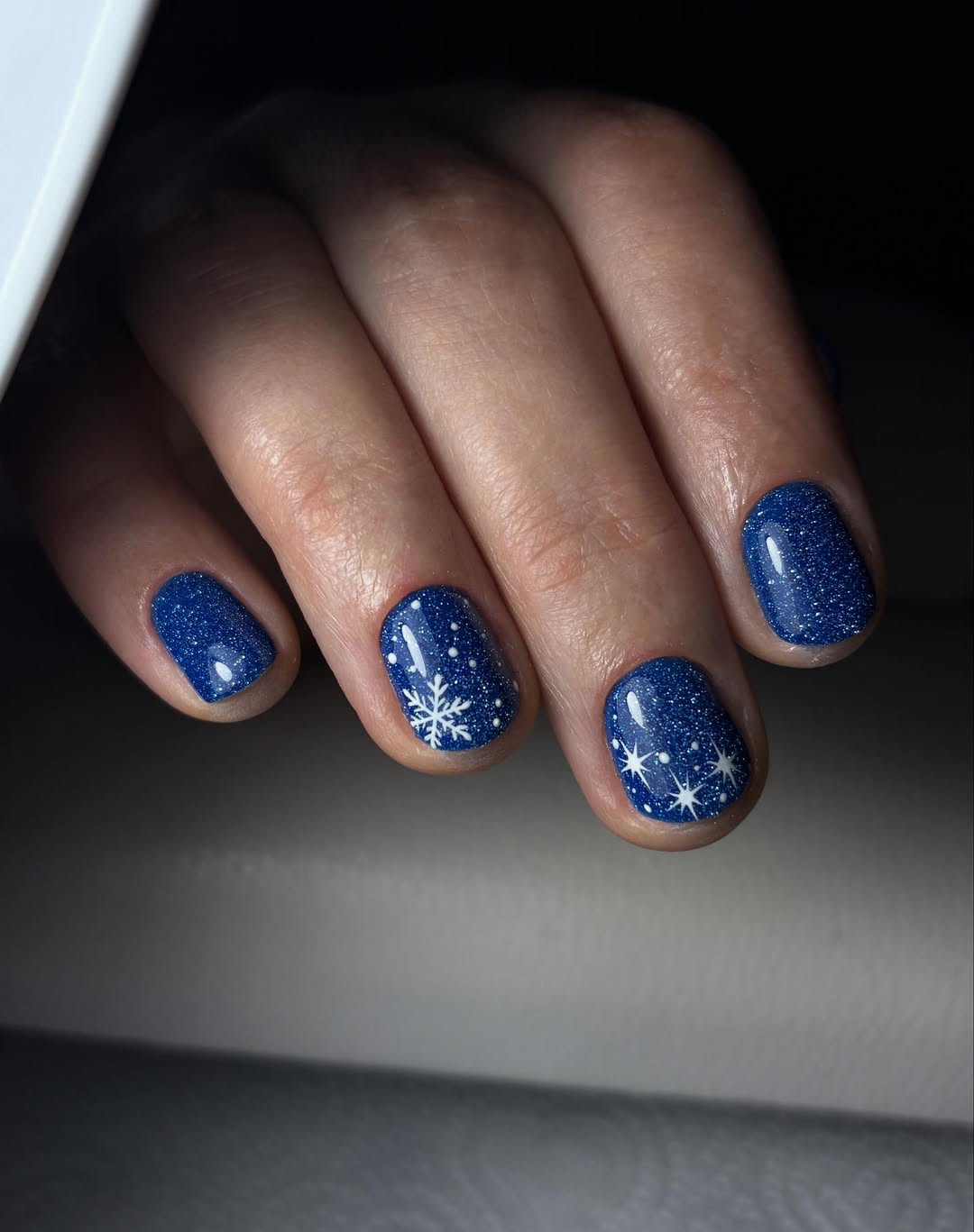 Sparkling Midnight Blue Snowflake Nails