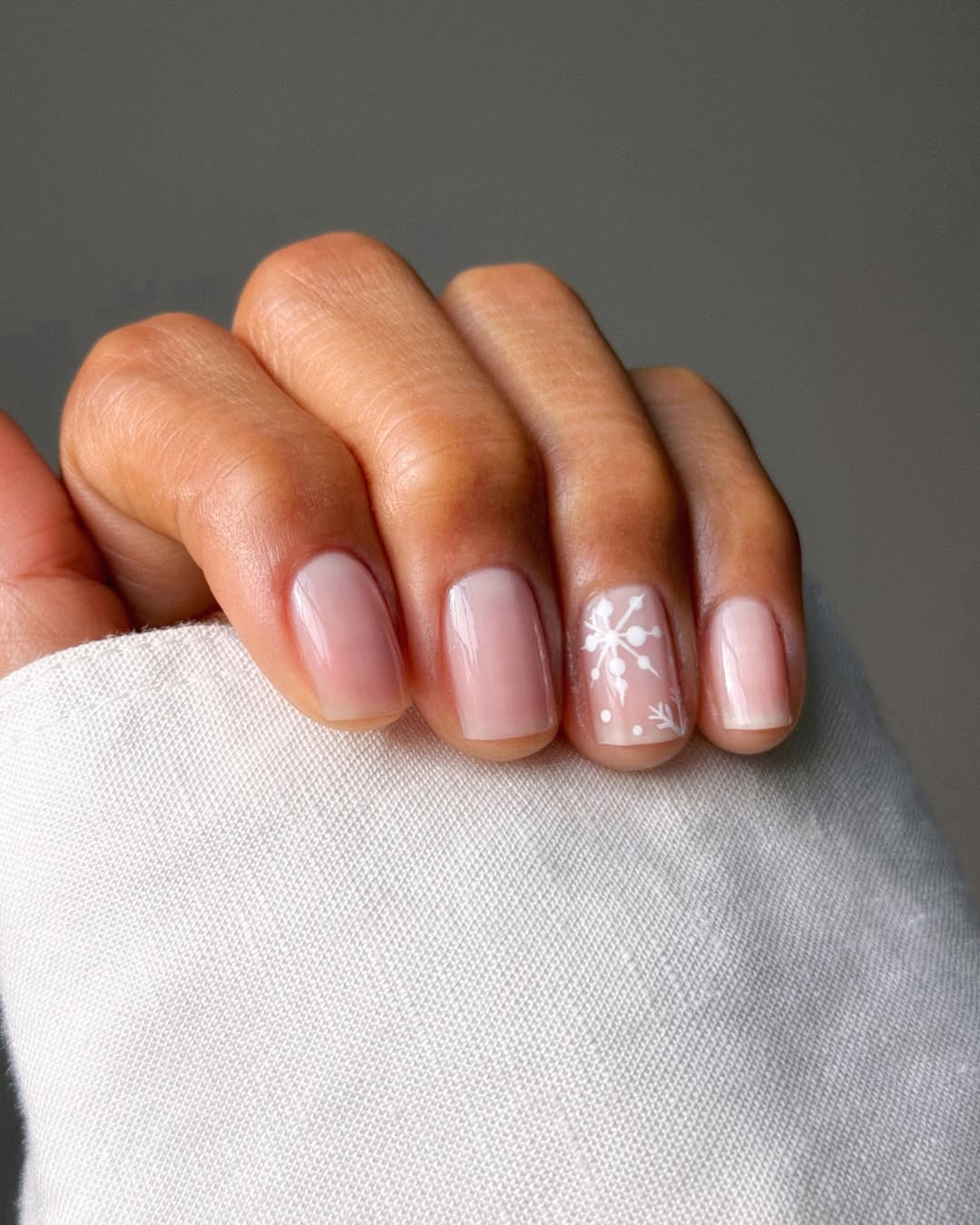 Subtle Snowflake Milky Nude Nails