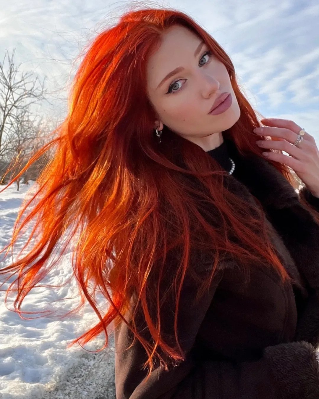 Vibrant Fiery Red Waves With Face-Framing Layers
