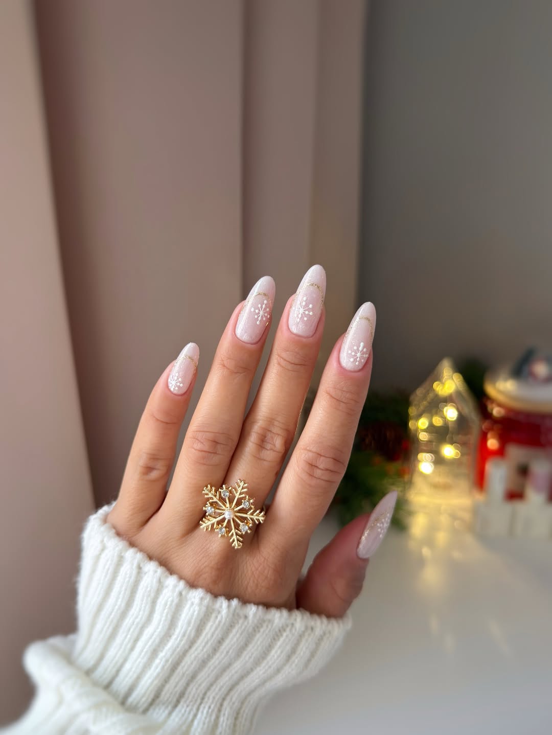 White Snowflake Almond Nails with Gold Accents