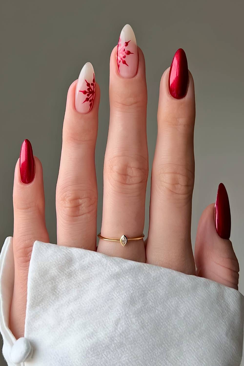 Metallic Red Oval Nails With Snowflake Accents — Winter Christmas Nails