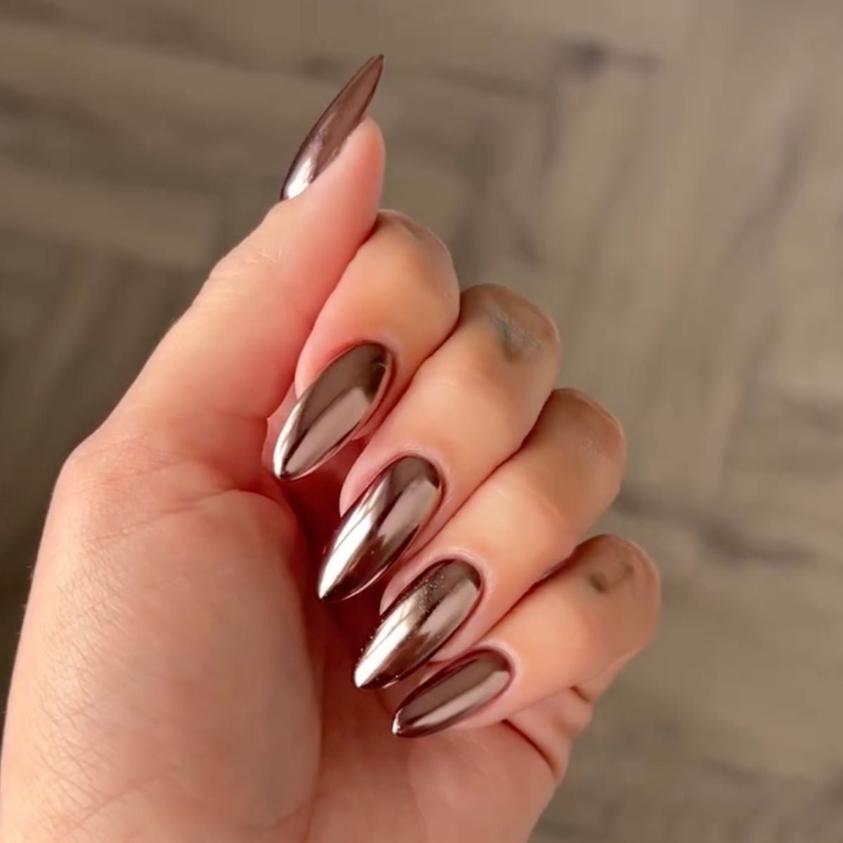 Long Stiletto Bronze Silver Chrome, Close-Up Take — Winter Chrome Nails