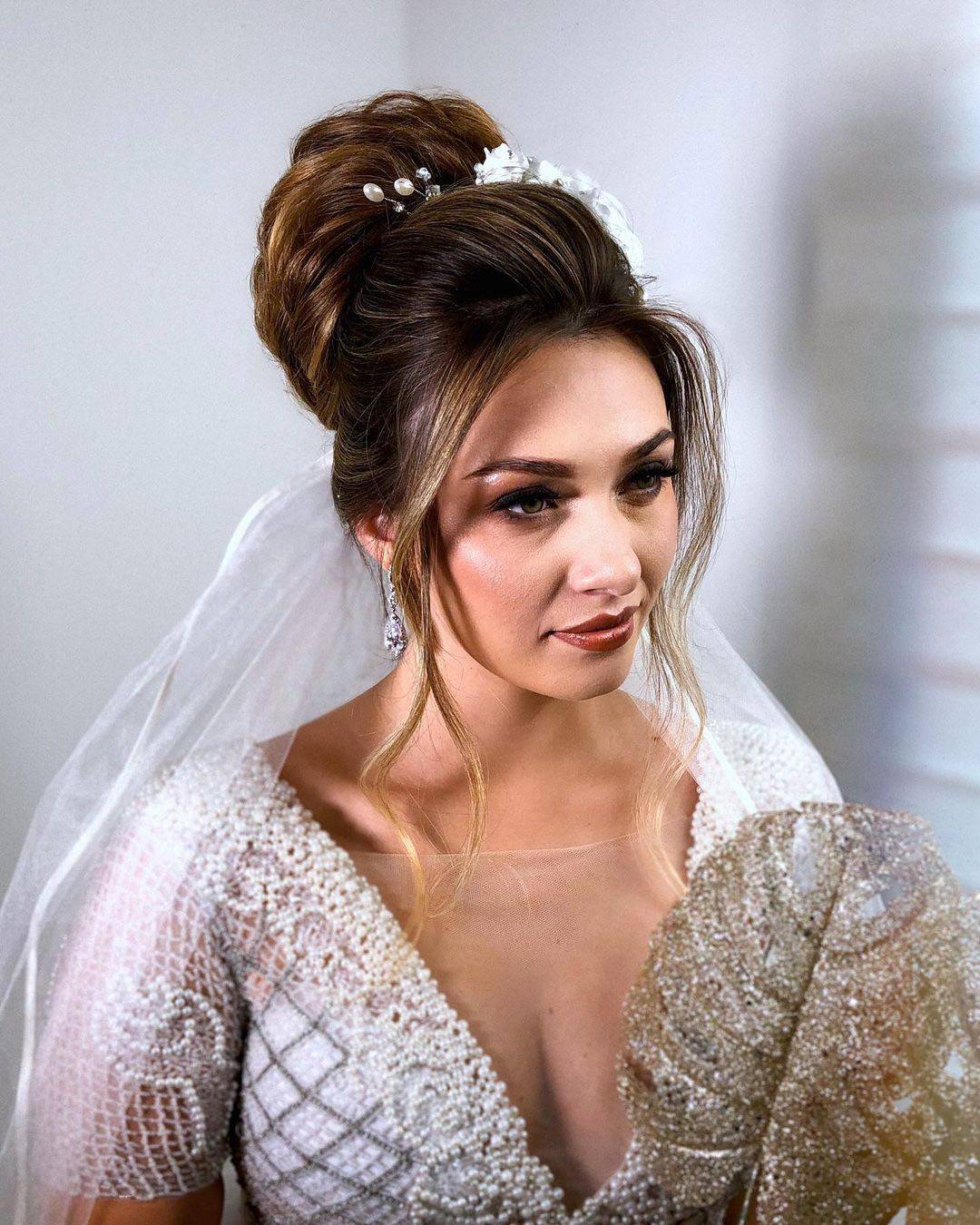 Voluminous Bun With Pearl and Floral Accessories — Winter Formal Hairstyles