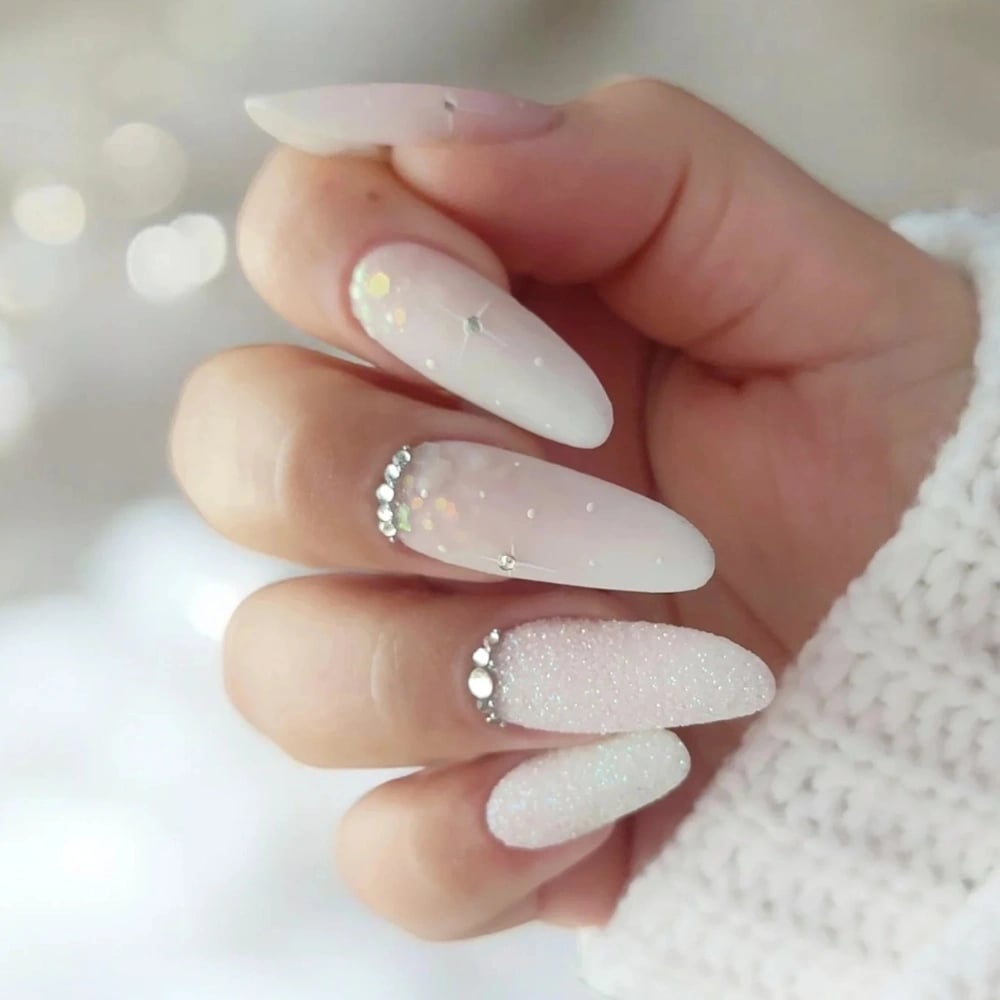Milky White Almond Nails With Glitter and Rhinestone Accents — Winter White Nails