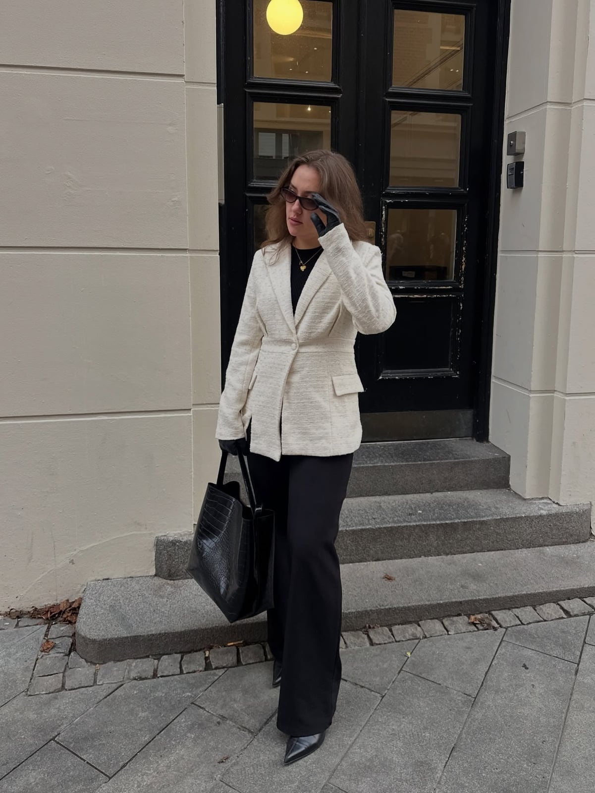 Cream Textured Blazer Over a Black Top and Wide-Leg Pants — Winter Work Outfits